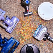 vacuum cleaners on carpet with spilled cereal