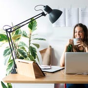 woman working at desk with clip on lamp